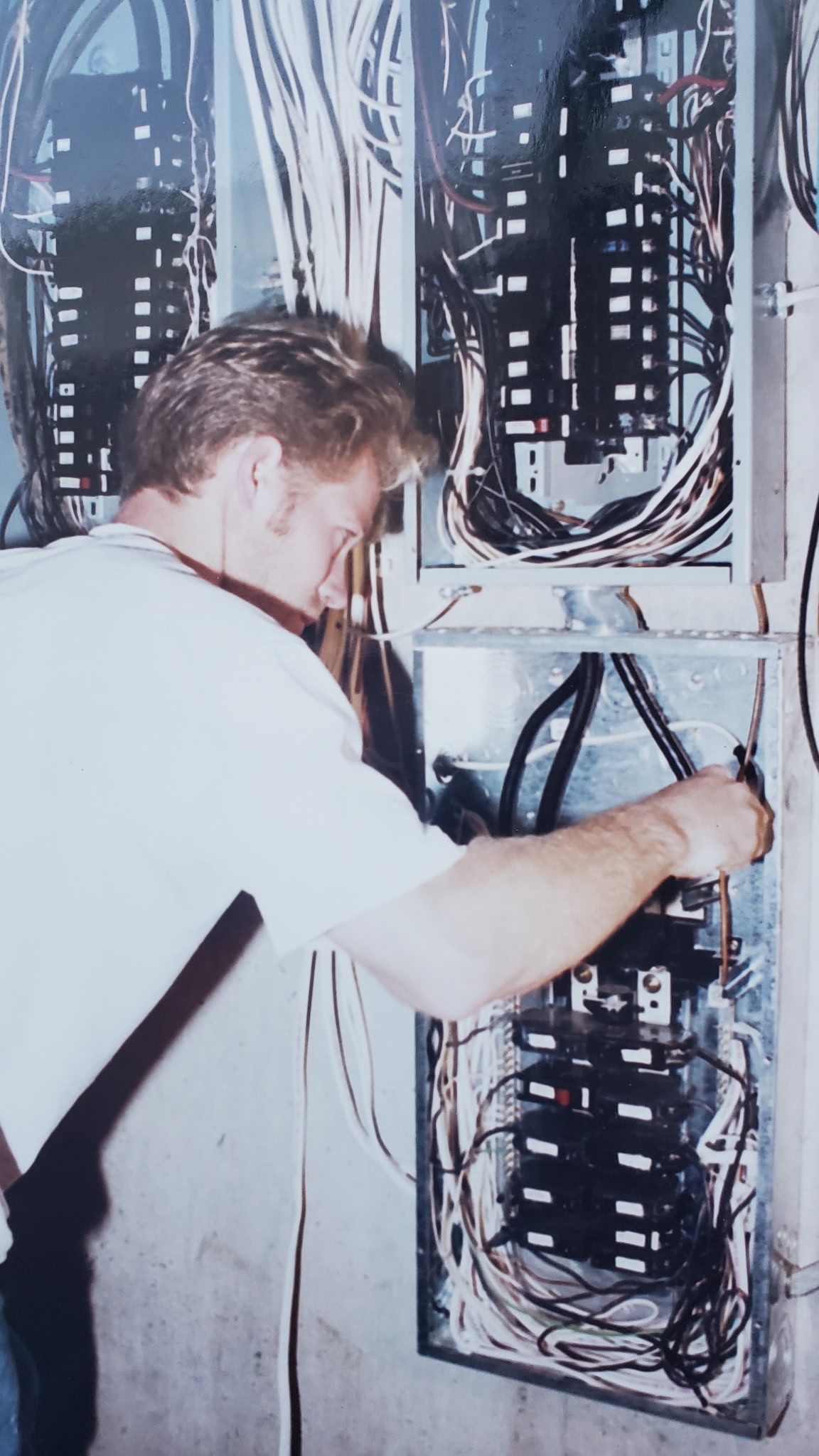 Scott wiring an electrical panel in the shop